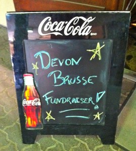 Entrance sign for silent auction in support of Devon.