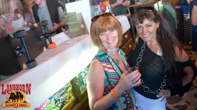 Making the rounds at the silent auction tables and bidding!