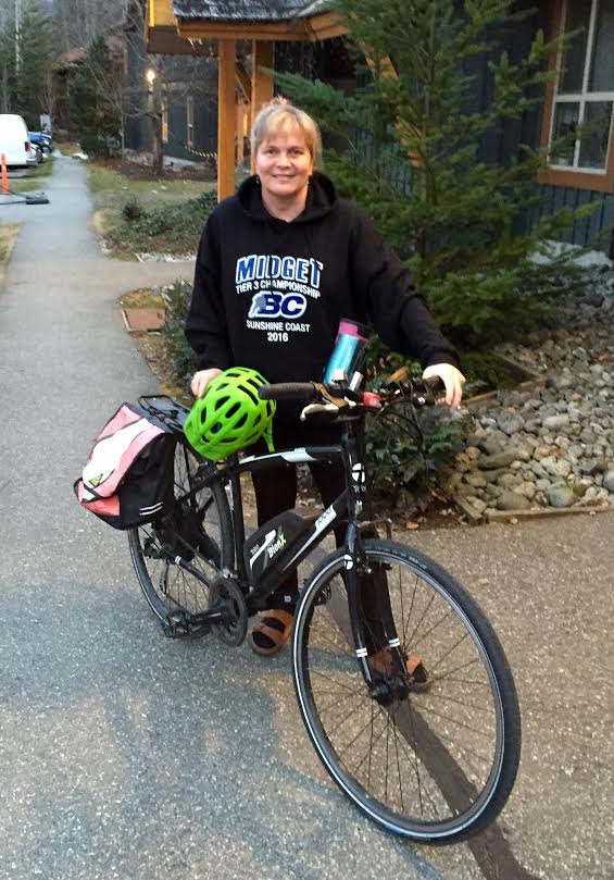 Devon posing with Betty, her electric bike.