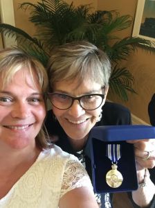 Mom and I posing with dad's award after the ceremony. Very proud of my dad.